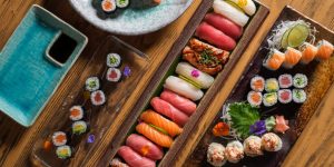various-sushi-wooden-table-scaled
